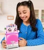 A young girl is smiling and looking at a toy toaster with a unicorn character popping out. Anteprima dell’immagine prodotto