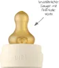 A close-up of a baby bottle nipple and the top of the bottle, with text and an arrow pointing to the nipple. Anteprima dell’immagine prodotto