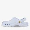 A white clog shoe is shown in profile against a white background. Produktbild-Vorschau