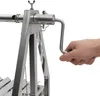 A close-up shot of a person's hand turning the crank of a stainless steel grill. Anteprima dell’immagine prodotto