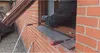 A person is installing a window frame using tools. Produktbild-Vorschau