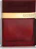 A close-up studio shot of a red Guess Seductive Red Eau de Toilette bottle with a gold band. Voir les images du produit