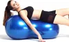 A woman is lying on a blue peanut ball. Produktbild-Vorschau