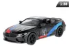 Modello in scala 1:38, BMW M8 Competition Coupé, nero Anteprima dell’immagine prodotto 1