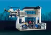 A Playmobil police station with a helicopter on a landing pad, figures, and interior details. Produktbild-Vorschau