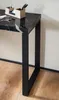 A close-up view of a black marble-look console table with a black metal frame, showing a desk organizer with pens on top. Produktbild-Vorschau