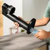 A person is inserting a water filter into a black water carbonator. Produktbild-Vorschau