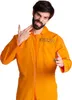 A man wearing an orange jumpsuit with the number 6103297 on it, making a gesture with his hands. Produktbild-Vorschau