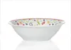 A white ceramic bowl with a floral pattern around the rim, set against a white background. Produktbild-Vorschau