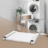 A laundry room scene with a washing machine and dryer stacked, a shelf with towels and plants, and a white pull-out frame in the foreground. Náhľad obrázku produktu