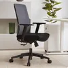 An office chair is shown in a well-lit room with a desk and a plant in the background. Produktbild-Vorschau
