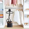 A garment steamer is shown in a closet with clothes hanging on a rack. Produktbild-Vorschau