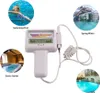 A water quality tester is shown in the center, surrounded by circular images of different water environments: a swimming pool with a child, a natural spring, a sauna center, and a spa pool. Náhled obrázku produktu