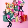 A pile of Sephora advent calendars and gift boxes with two miniature figures interacting with the products. Produktbild-Vorschau