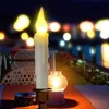 A table setting at night with decorative candles and blurred lights in the background. Produktbild-Vorschau
