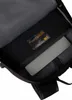 Inside view of a backpack, showing a laptop compartment with a grey laptop inside and a label with text. Produktbild-Vorschau