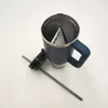 A blue Stanley tumbler with its lid and straw detached, placed on a white surface. Produktbild-Vorschau