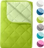 A folded green quilted blanket shown from above, with a lighter green inner lining visible. Produktbild-Vorschau