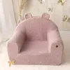 A pink, teddy bear-shaped children's armchair is shown in a room with decorative butterflies on the wall. Produktbild-Vorschau