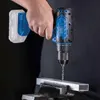 A person is using a cordless drill to drill into a metal bar held in a vise. Produktbild-Vorschau