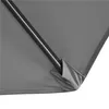 Close-up view of the corner of a gray umbrella, showing the fabric and a metal pole. Produktbild-Vorschau