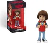A collectible figurine of Will from Stranger Things, shown both in its packaging and standing alone. Podgląd zdjęcia produktu