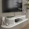 A white TV lowboard mounted on a textured gray wall, with a TV, a book, a decorative object, and a lantern on it. Podgląd zdjęcia produktu