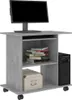 A computer desk with a monitor, keyboard, computer tower, books, and a storage box. Náhled obrázku produktu