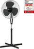 A black and silver standing fan is shown against a white background, with a promotional badge in the top right corner. Náhled obrázku produktu