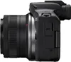 Side view of a black Canon EOS R50 mirrorless camera with a lens attached. Voir les images du produit