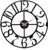 A black metal wall clock with gold hands against a white background. Podgląd zdjęcia produktu