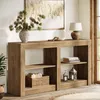 A wooden console table with shelves, decorated with a vase of pine branches, a bowl of beads, a lamp, books, and lanterns. Produktbild-Vorschau