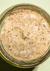 A close-up view of mustard in a glass jar. Produktbild-Vorschau