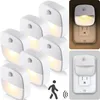 A collage of LED night lights plugged into electrical outlets, with a graphic indicating motion detection. Náhled obrázku produktu