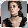 A young woman wearing a black choker necklace. Produktbild-Vorschau