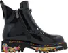 A black patent leather boot with a colorful, abstract design on the sole. Produktbild-Vorschau