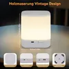A white LED table lamp with dimensions indicated, shown on a table with additional detail shots of its features. Voir les images du produit