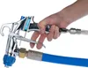 A hand holding a spray gun connected to a blue hose. Anteprima dell’immagine prodotto