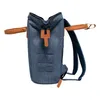 A side view of a blue backpack with brown leather accents. Produktbild-Vorschau