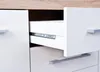 A close-up view of an open drawer in a white cabinet with a wooden top. Produktbild-Vorschau