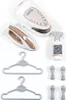 A toy ironing set for children, including an ironing board, iron, spray bottle, and hangers, laid out on a white background. Produktbild-Vorschau