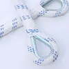 A close-up view of a white rope with blue markings and metal loops, likely part of a fire escape ladder. Produktbild-Vorschau