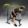 A man is performing a dumbbell row exercise on a black weight bench, with a black squat rack in the background. The word 'Core' is prominently displayed in a neon yellow outline behind him. Náhled obrázku produktu