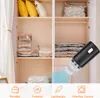 Inside a wardrobe, vacuum storage bags are neatly stacked on shelves, and a black electric vacuum pump is shown in the foreground with a blue suction effect. Náhled obrázku produktu