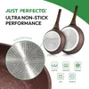 A marketing image showcasing two frying pans with their induction bases highlighted, along with icons indicating compatibility with different heat sources. Voir les images du produit