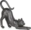 A dark-colored cat figurine stretching on a white background. Anteprima dell’immagine prodotto