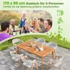 People enjoying an outdoor meal at a wooden table with chairs. Náhled obrázku produktu