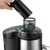 A hand is holding a black component over the top of a juicer. Produktbild-Vorschau