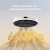 A robot vacuum cleaner is shown hovering over a pile of sand, with the text '6000Pa' prominently displayed in the sand. The background is a gradient of light blue to light yellow. Voir les images du produit