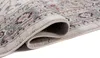 A close-up view of a rolled-up rug, showing its intricate pattern and textured surface. Produktbild-Vorschau